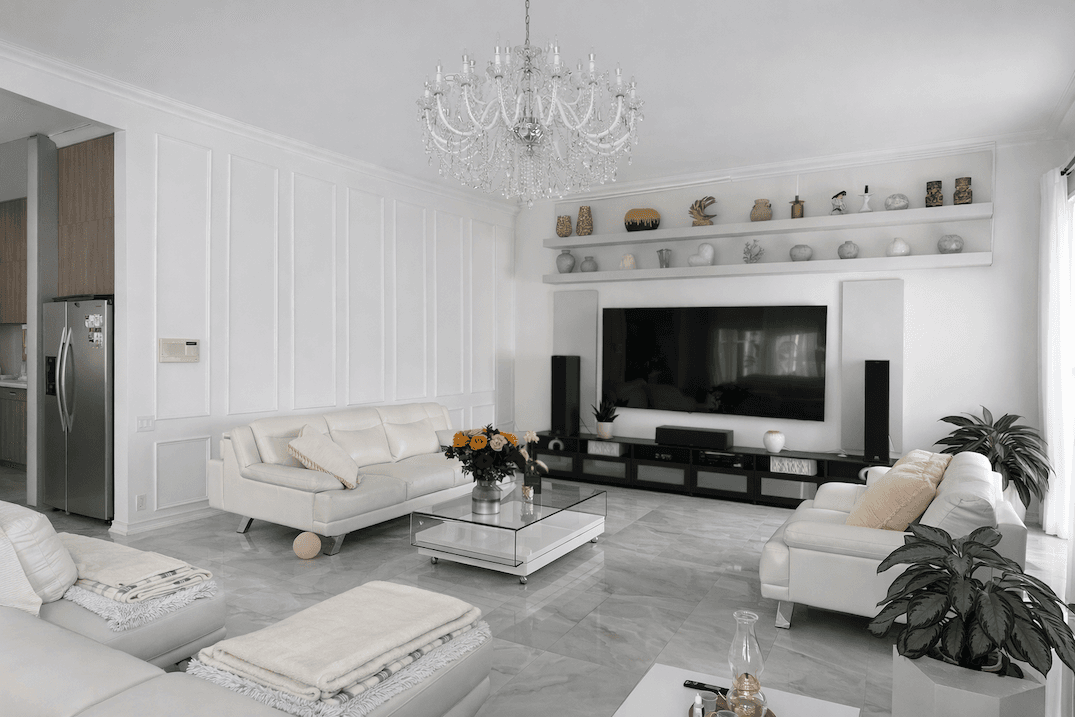 Open-concept kitchen and living space with large island, custom cabinetry, and polished tile flooring