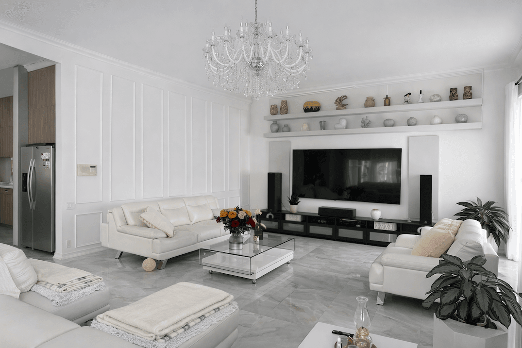 Open-concept kitchen and living space with large island, custom cabinetry, and polished tile flooring